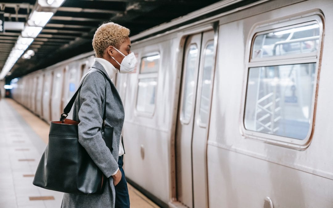 Woman Business Leader With Facemask Waits On Subway Car To Open